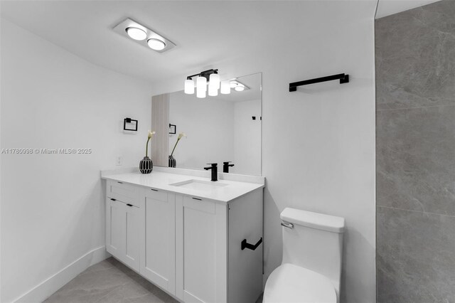 1301 NE 191st St Unit F117, Miami, FL 33179 - bathroom with toilet, marble finish floor, vanity, and baseboards