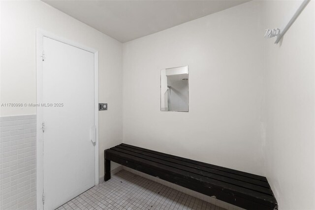 1301 NE 191st St Unit F117, Miami, FL 33179 - hall with light tile patterned floors
