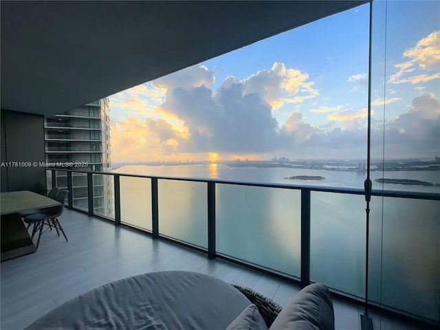 balcony featuring a water view