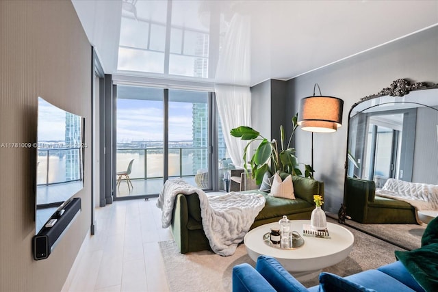 bedroom featuring a high ceiling and access to exterior