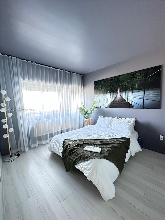 bedroom featuring wood finished floors