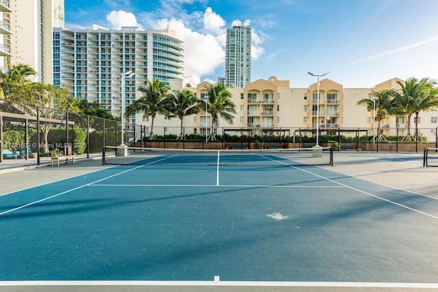 view of sport court featuring fence