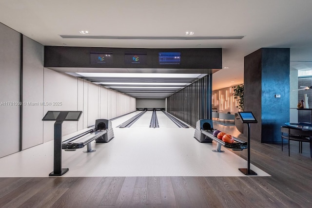 playroom featuring a bowling alley and wood finished floors