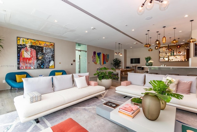 living room featuring recessed lighting and wood finished floors