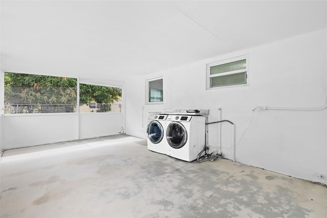 washroom featuring laundry area and washer and clothes dryer