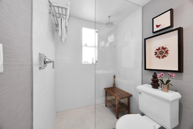 full bath with tile walls, walk in shower, and toilet