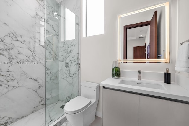 full bathroom featuring vanity, a marble finish shower, visible vents, and toilet