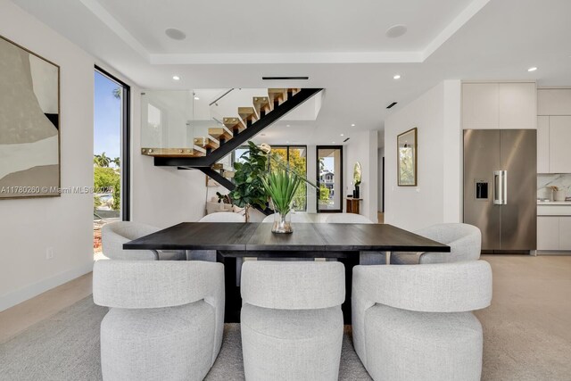 dining space with plenty of natural light, recessed lighting, and stairs