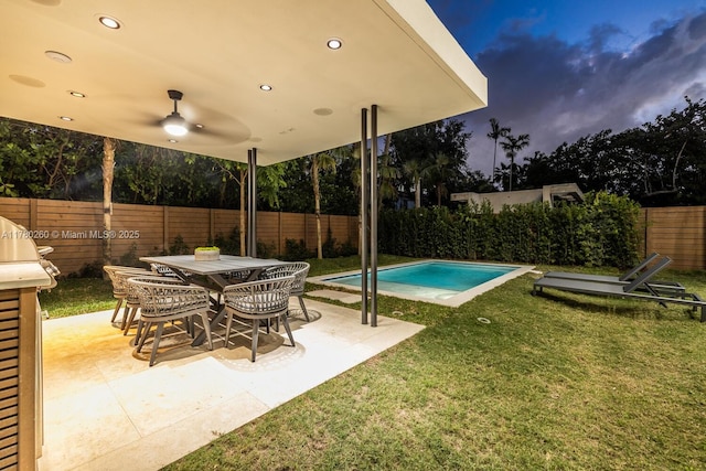 view of swimming pool with a lawn, a fenced backyard, a patio area, and a fenced in pool