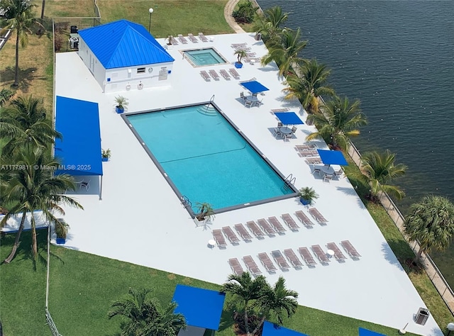 birds eye view of property with a water view
