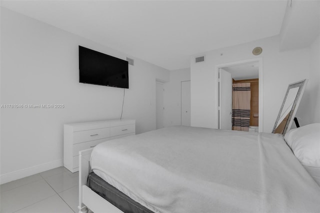 bedroom with baseboards, visible vents, and light tile patterned floors