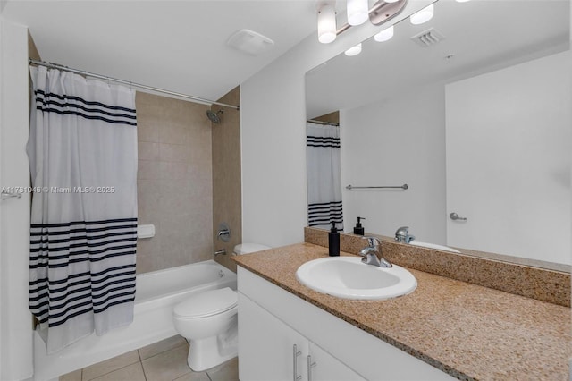 bathroom with tile patterned floors, visible vents, toilet, vanity, and shower / bath combo