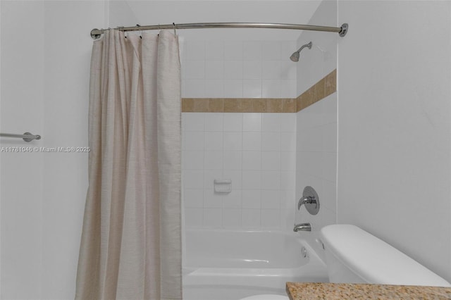 full bathroom featuring shower / tub combo, vanity, and toilet