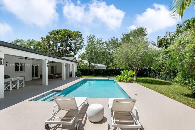 7551 SW 109th Ter, Pinecrest, FL 33156 - view of pool with a patio area, a ceiling fan, and a yard