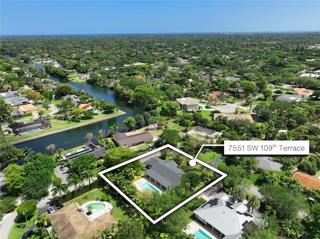 7551 SW 109th Ter, Pinecrest, FL 33156 - aerial perspective of suburban area featuring property boundaries highlighted and a large body of water