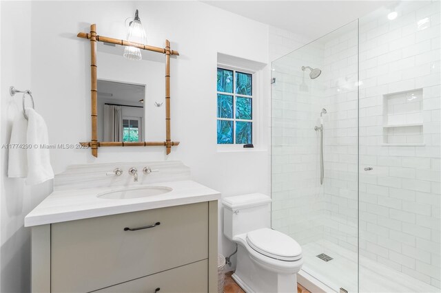 1225 N Greenway Dr, Coral Gables, FL 33134 - bathroom featuring tiled shower, toilet, and vanity