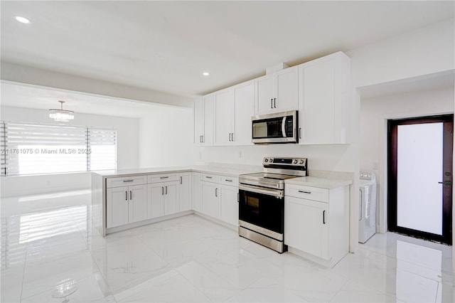 kitchen with stainless steel appliances, washer / clothes dryer, white cabinetry, a peninsula, and light countertops