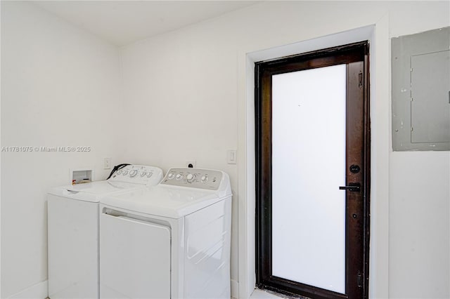 laundry area featuring electric panel, laundry area, and washing machine and dryer