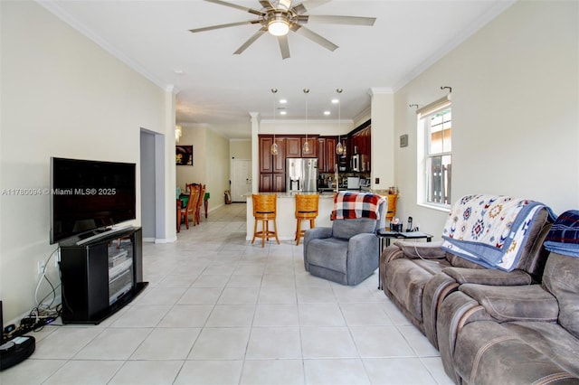 living area featuring ceiling fan, ornamental molding, light tile patterned floors, and recessed lighting
