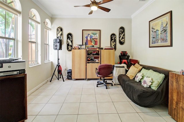 living area featuring ornamental molding, ceiling fan, and baseboards
