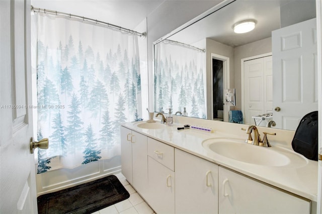 bathroom featuring tile patterned floors, shower / bathtub combination with curtain, double vanity, and a sink