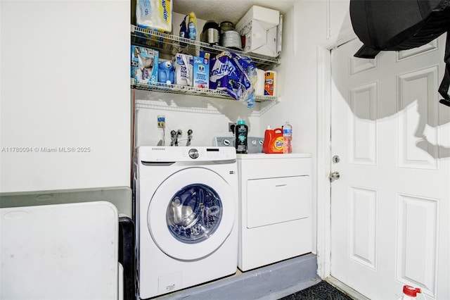 laundry area with separate washer and dryer and laundry area