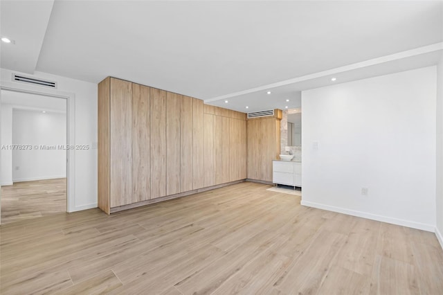 1658 Bay Rd Unit 504, Miami Beach, FL 33139 - empty room with light wood-type flooring, baseboards, visible vents, and recessed lighting