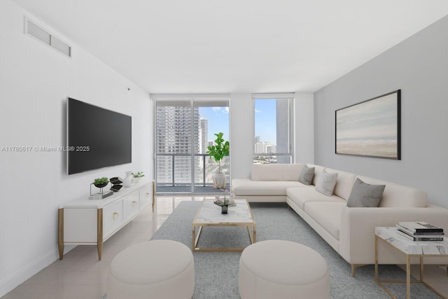 living room with baseboards, visible vents, and expansive windows