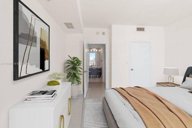 bedroom featuring light tile patterned flooring and visible vents