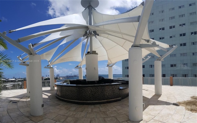 view of patio / terrace with fence and an outdoor bar