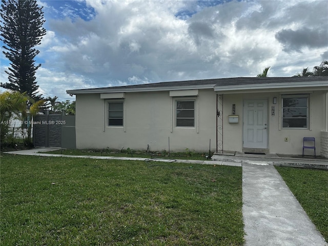 7540 SW 37th St, Miami, FL 33155 - ranch-style home featuring roof with shingles, stucco siding, fence, and a front lawn
