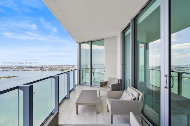 balcony featuring a water view
