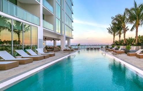 community pool with a patio area