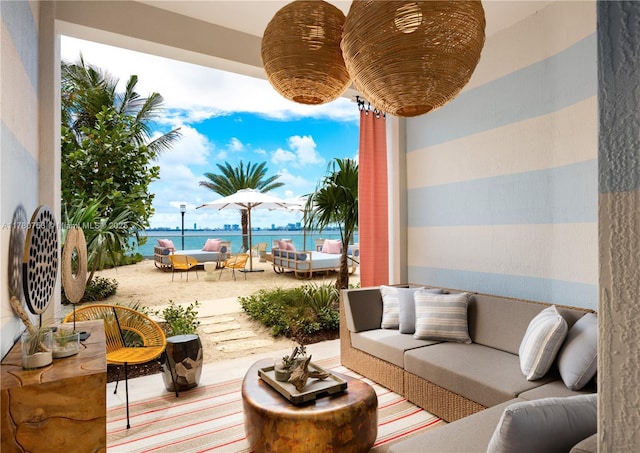 view of patio / terrace with an outdoor living space and a water view