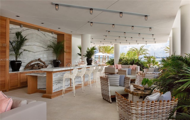 view of patio / terrace with an outdoor living space and outdoor wet bar