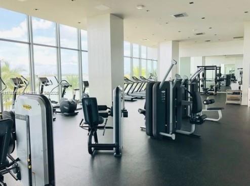 exercise room with a wall of windows