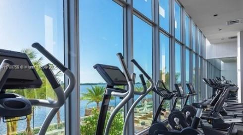 exercise room with visible vents and plenty of natural light