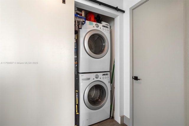 3470 E Coast Ave Unit H2601, Miami, FL 33137 - laundry area with stacked washer / dryer and a barn door