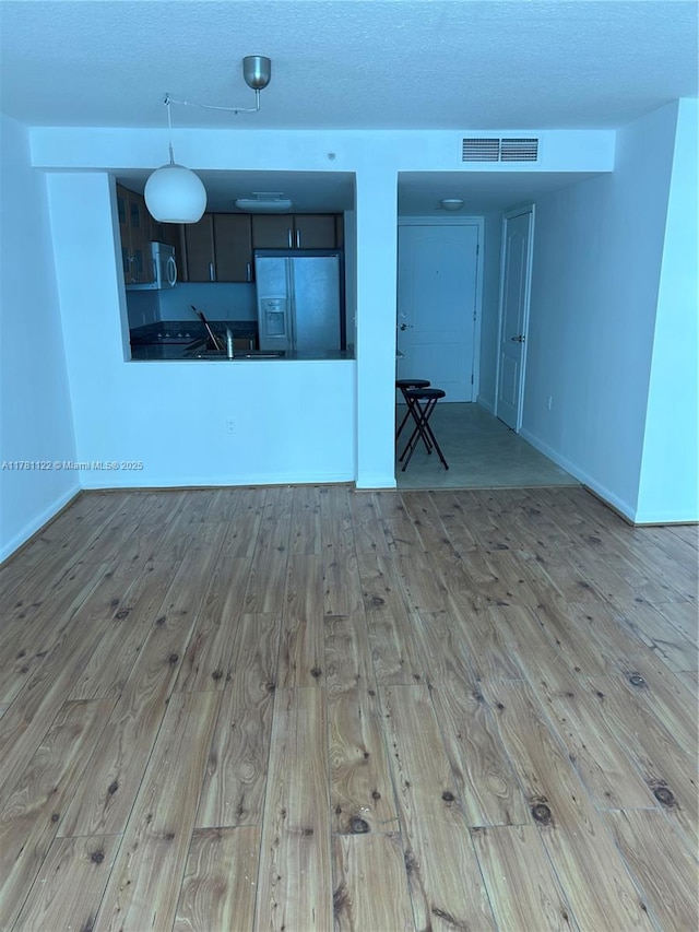 2101 Brickell Ave Unit 502, Miami, FL 33129 - unfurnished room with wood-type flooring and a textured ceiling