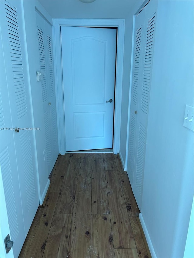 2101 Brickell Ave Unit 502, Miami, FL 33129 - corridor featuring wood finished floors and baseboards