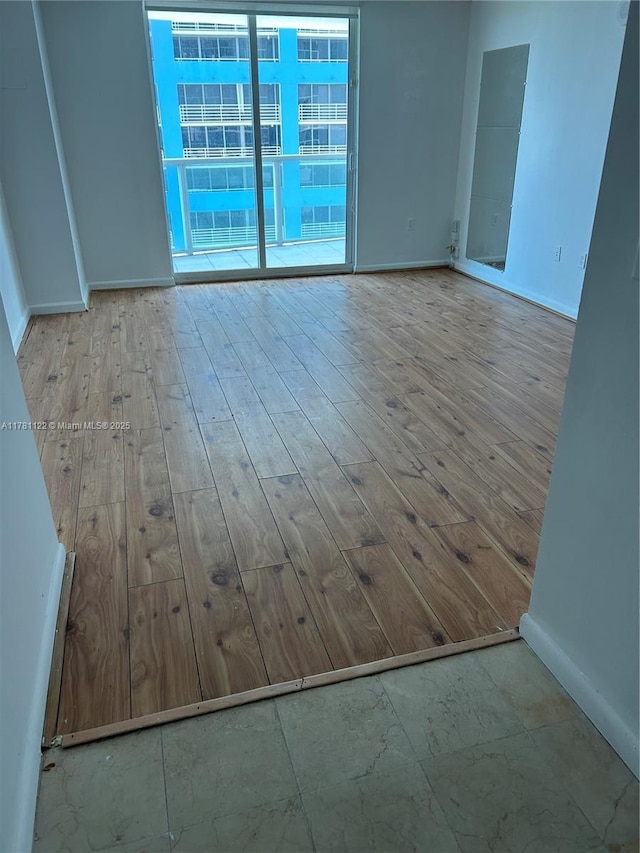 2101 Brickell Ave Unit 502, Miami, FL 33129 - unfurnished room featuring wood finished floors and baseboards