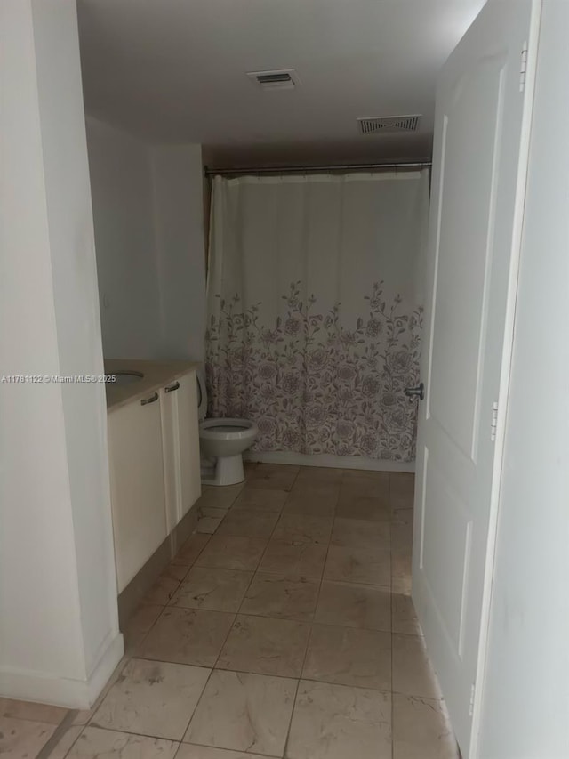 2101 Brickell Ave Unit 502, Miami, FL 33129 - bathroom with vanity and curtained shower