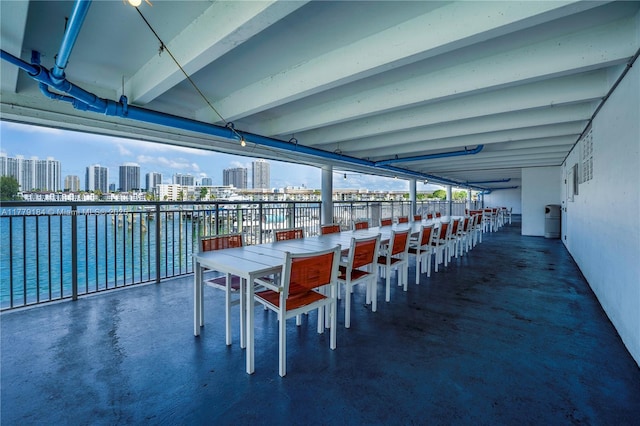 view of patio featuring a view of city and a water view