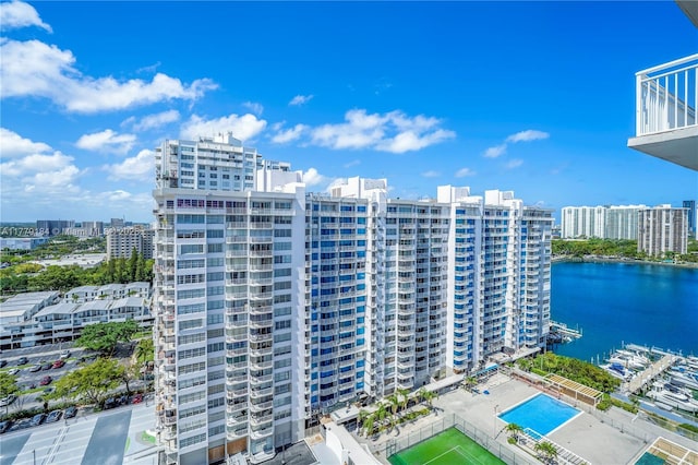view of property featuring a view of city and a water view