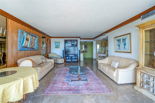 living room featuring visible vents, a textured ceiling, and crown molding