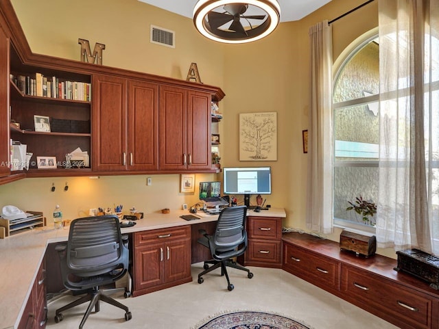 office featuring built in desk and visible vents