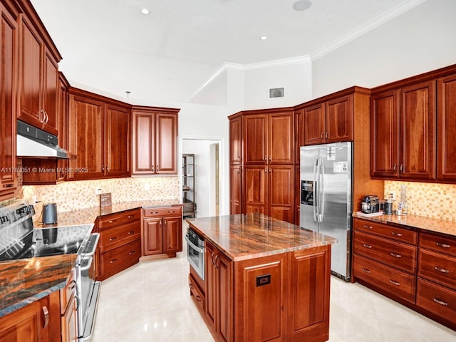 kitchen with dark stone countertops, visible vents, appliances with stainless steel finishes, under cabinet range hood, and backsplash