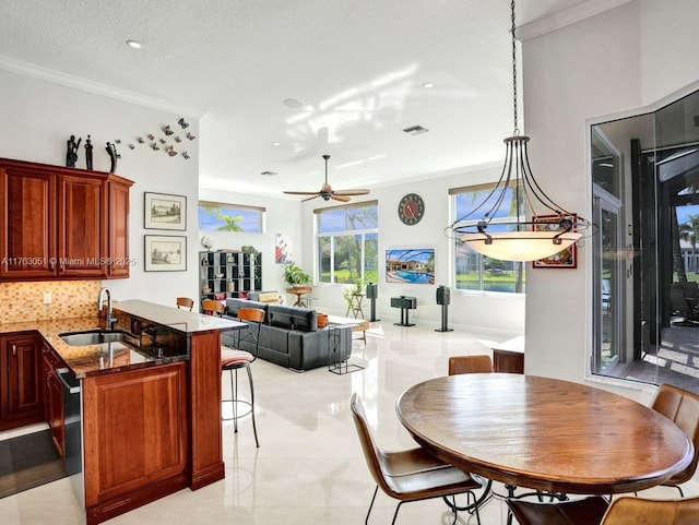 dining room featuring visible vents, light tile patterned floors, a ceiling fan, crown molding, and recessed lighting