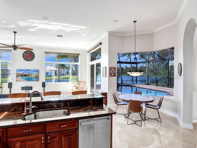 kitchen with dishwasher, ornamental molding, a sink, and dark brown cabinets