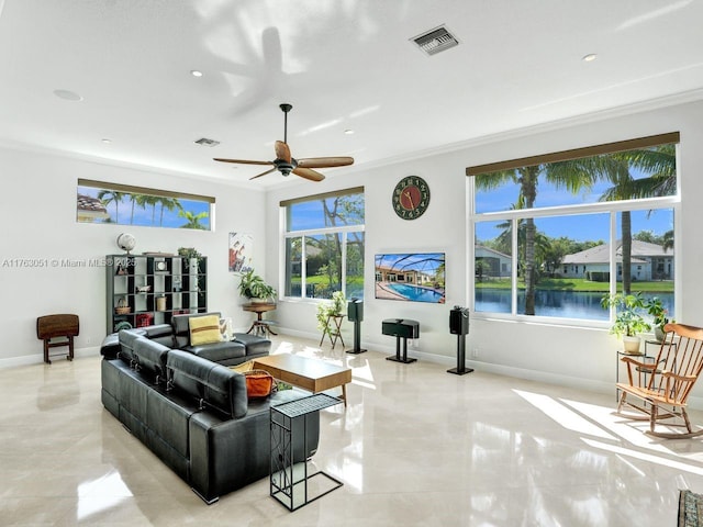 living area featuring plenty of natural light, visible vents, and light tile patterned flooring